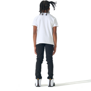 A child model shown from the back wearing a white short-sleeve t-shirt, black pants, and white sneakers, standing against a solid white background.