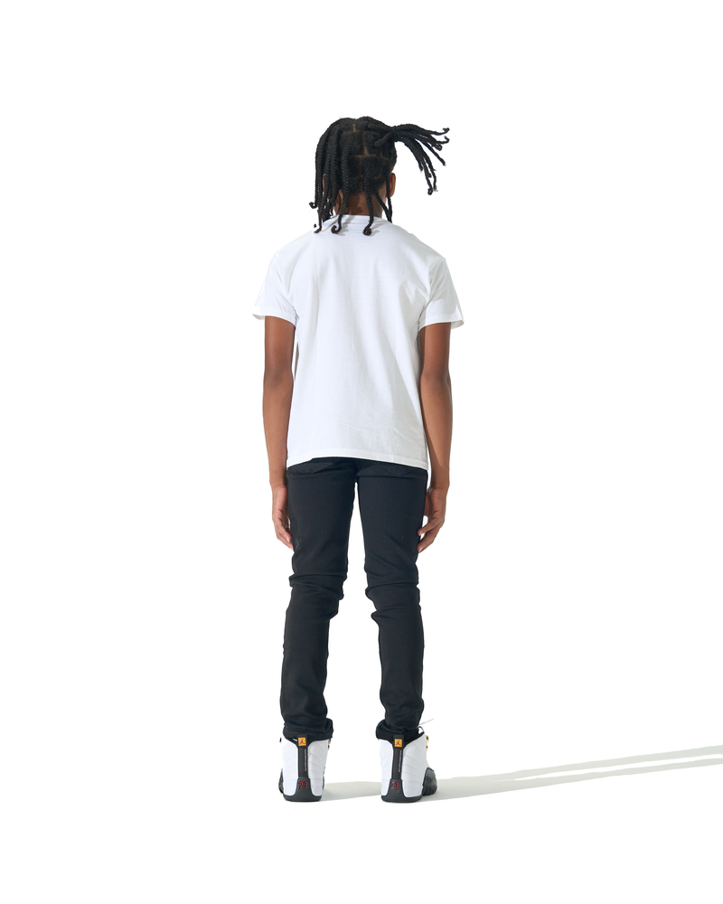 A child model shown from the back wearing a white short-sleeve t-shirt, black pants, and white sneakers, standing against a solid white background.