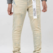 Light-colored distressed jeans with a brand tag on a white background