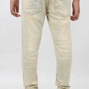 Person wearing light-colored jeans and a gray sweatshirt on a white background