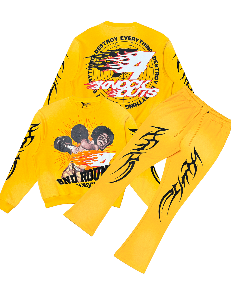 Yellow long-sleeve shirt with graphic designs and text on a white background