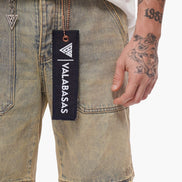 Denim shorts with a visible brand tag on a plain background