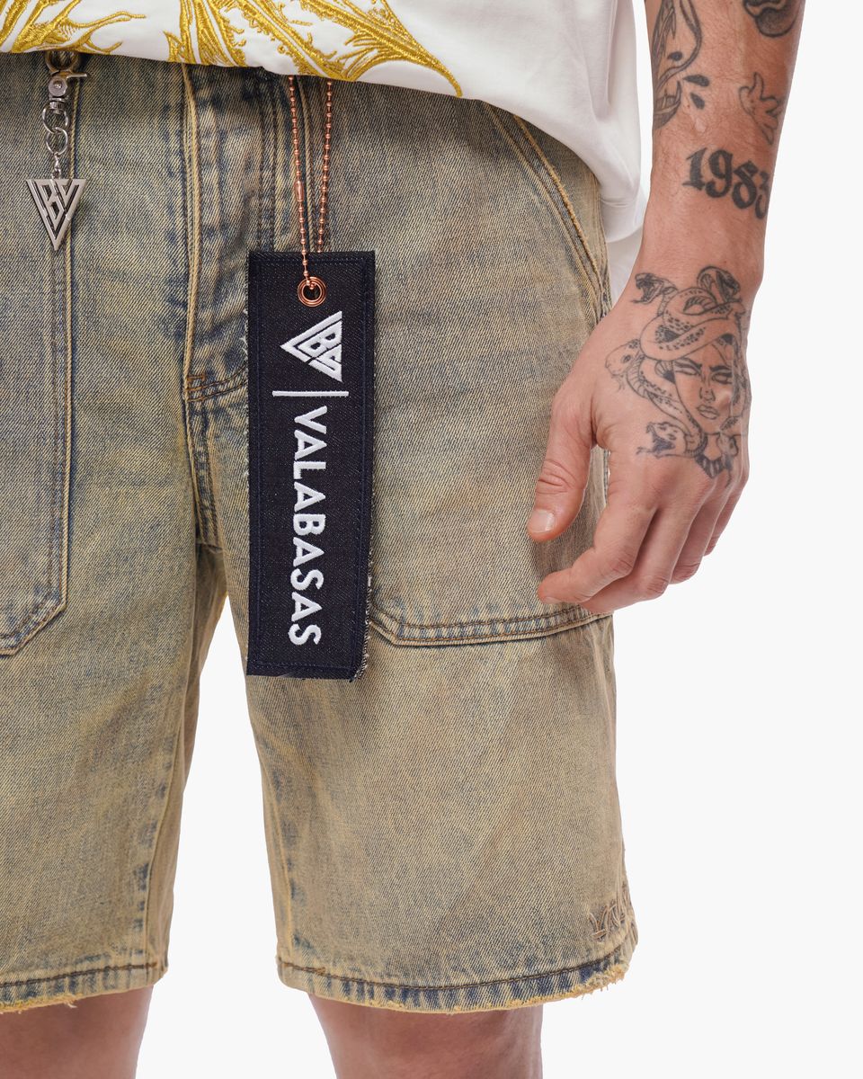 Denim shorts with a visible brand tag on a plain background