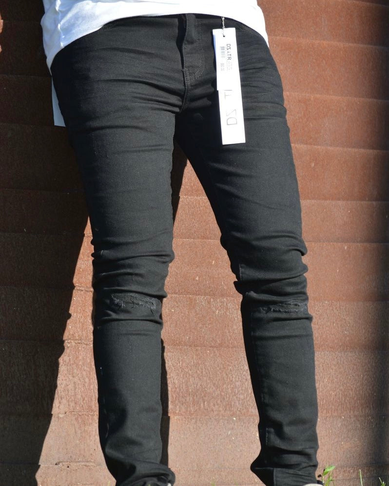 Knee top ripped jeans in black color 