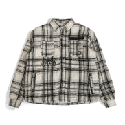 Plaid shirt with black accents on a white background