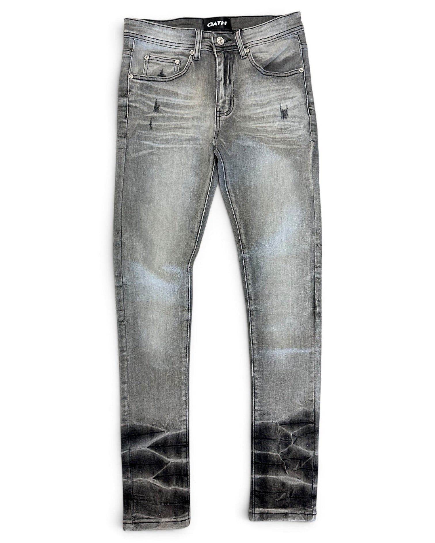 A pair of slim-fit denim jeans in a faded gray wash with a black acid-wash distressed finish at the hems, shown flat on a white background.