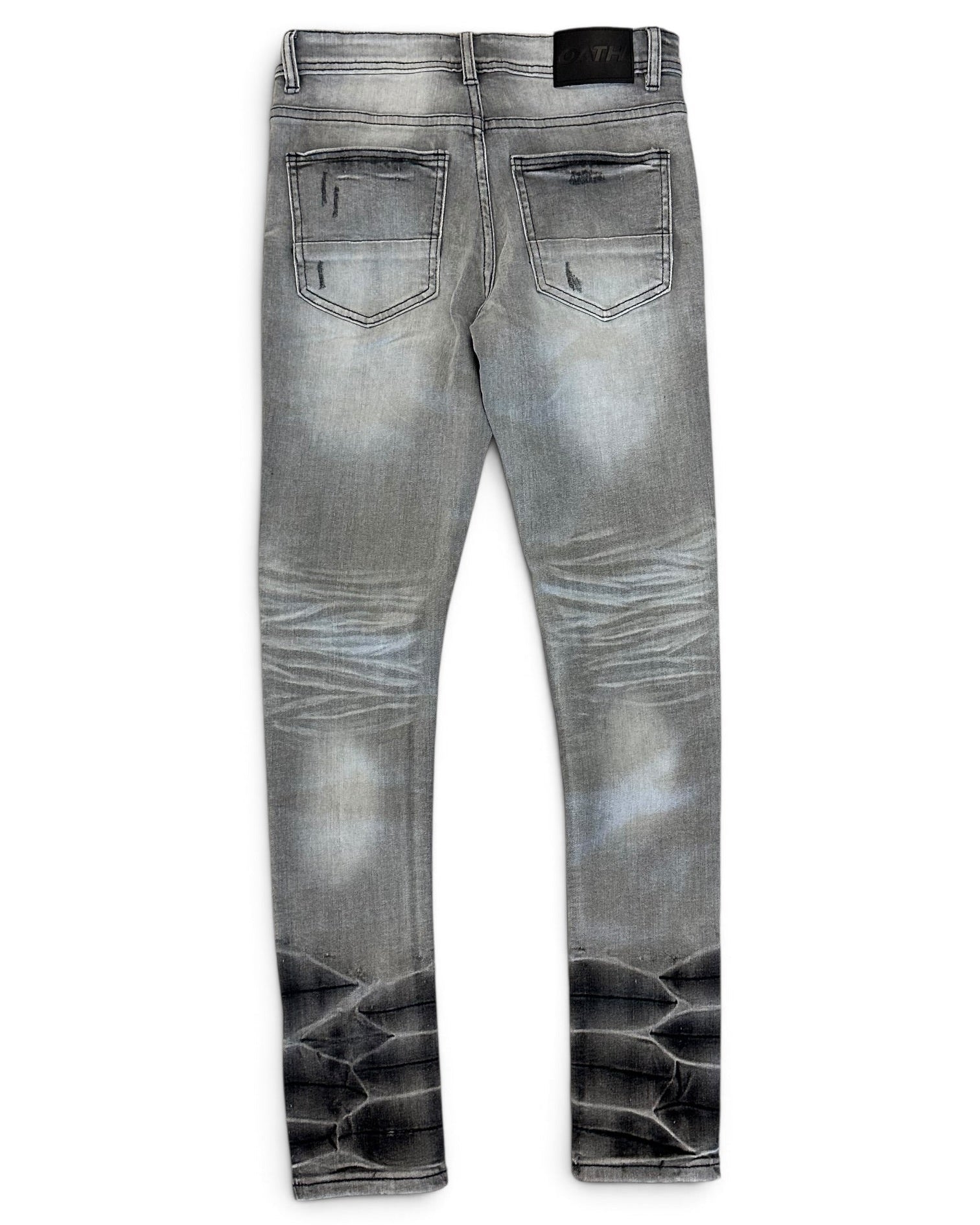 Gray denim jeans with a faded wash and a black reptile-scale pattern printed along the lower legs, shown from the back on a white background.