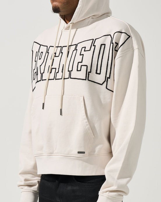 Person wearing a white hoodie with text design on a plain background