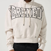 Person wearing a light gray hoodie with 'Serenity' printed on it against a white background