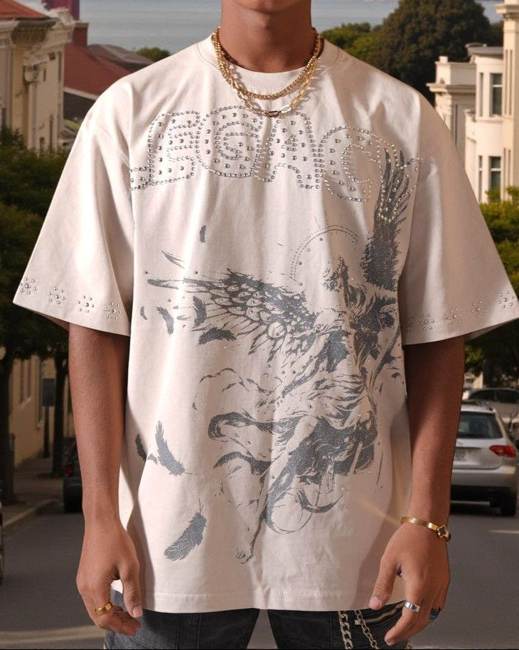 Man wearing a white graphic t-shirt with a cityscape in the background