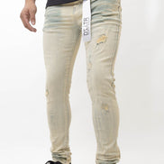 Person wearing light-colored distressed jeans with a visible brand label on a white background