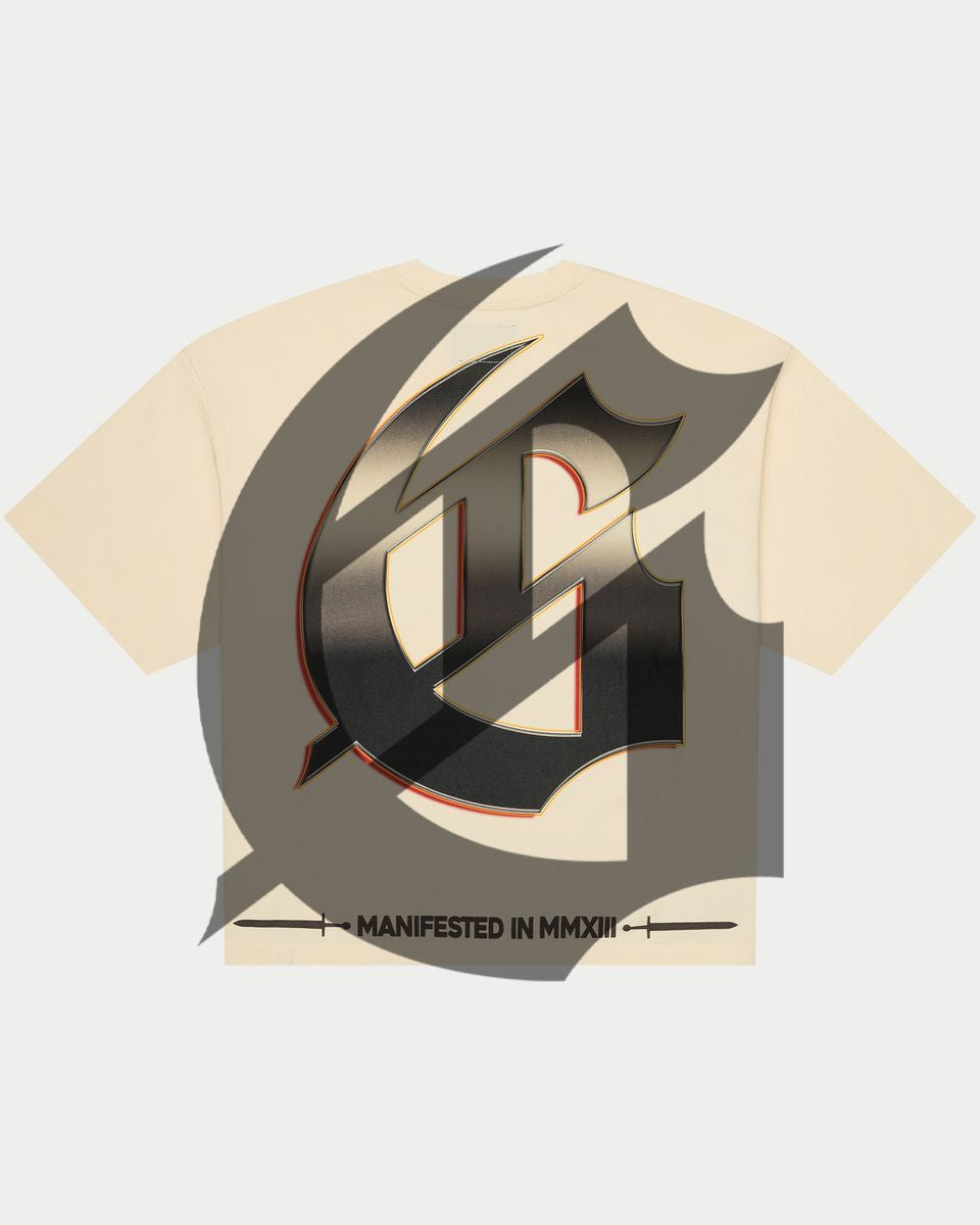 Beige t-shirt with a large black and gray logo on a light gray background