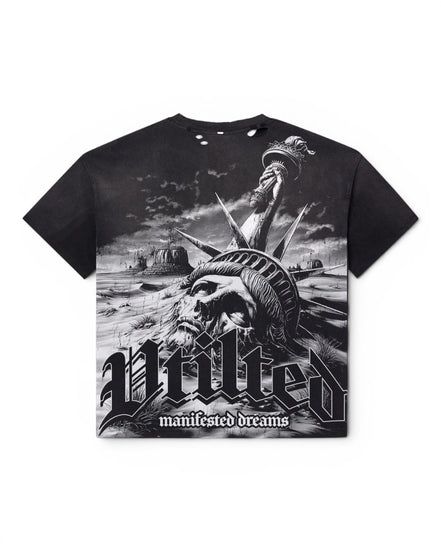A black short-sleeve graphic T-shirt featuring a monochrome illustration of the Statue of Liberty with a skull face and the text 'Vtilted' and 'manifested dreams' on the front, shown against a plain white background.