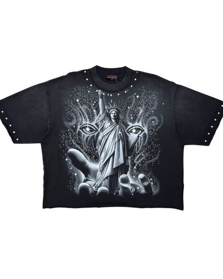 Black t-shirt with a graphic design of a figure between two animal heads on a white background