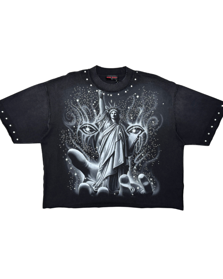 Black t-shirt with a graphic design of a figure between two animal heads on a white background