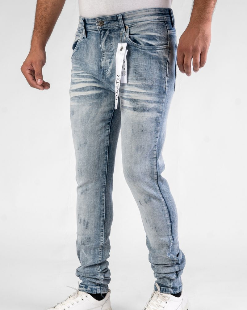 Light blue distressed jeans worn by a person on a white background