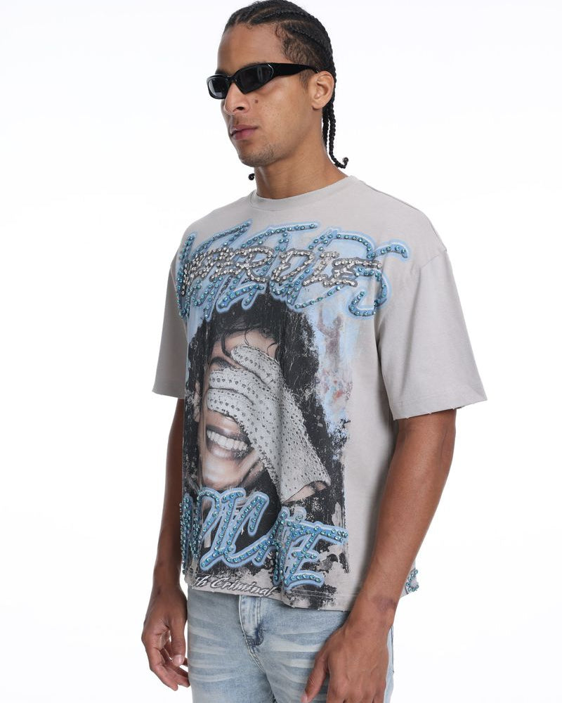 Man wearing a graphic t-shirt with a design of michael jackson on a white background