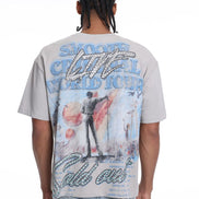Person wearing a t-shirt with a colorful graphic design on the back