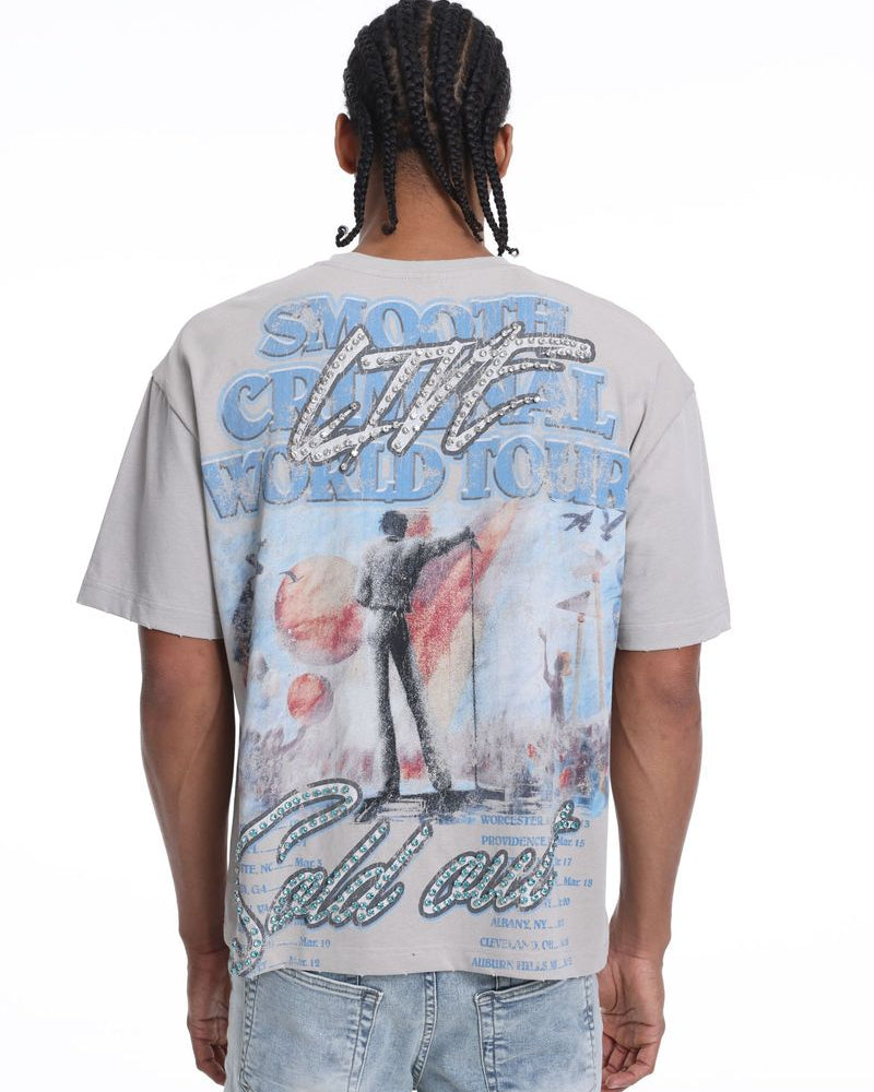 Person wearing a t-shirt with a colorful graphic design on the back