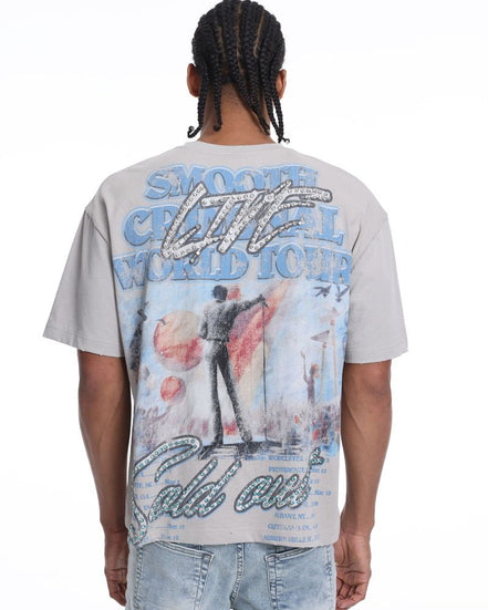 Person wearing a t-shirt with a colorful graphic design on the back