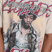 T-shirt with a graphic design of a person smoking a cigarette and text on a beige background