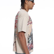 Man wearing a patterned shirt and sunglasses on a white background