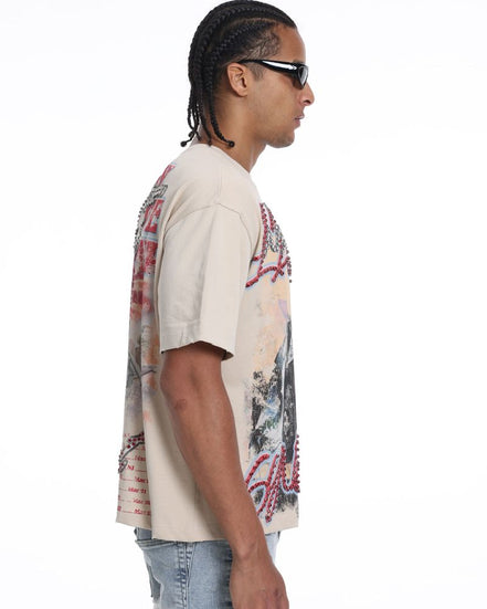 Man wearing a patterned shirt and sunglasses on a white background