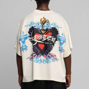 Person wearing a white t-shirt with colorful graphic design on the back against a gray background
