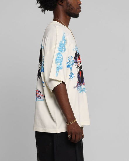 Person wearing a white shirt with blue and red designs on a gray background