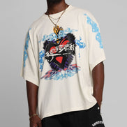 Person wearing a white t-shirt with colorful graphic design on a gray background