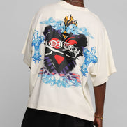 Person wearing a white t-shirt with colorful graphic design on a gray background