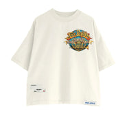 An oversized off-white t-shirt featuring a colorful graphic on the chest, with a small 'FREE-REFILLS' brand label on the bottom right hem and a small white tag on the bottom left hem, displayed against a solid white background.