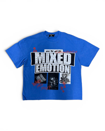 A blue short-sleeve graphic t-shirt featuring the text 'MIXED EMOTION' in distressed white letters inside a black block, with smaller black-and-white images and red splatter details on the front, shown against a plain white background.