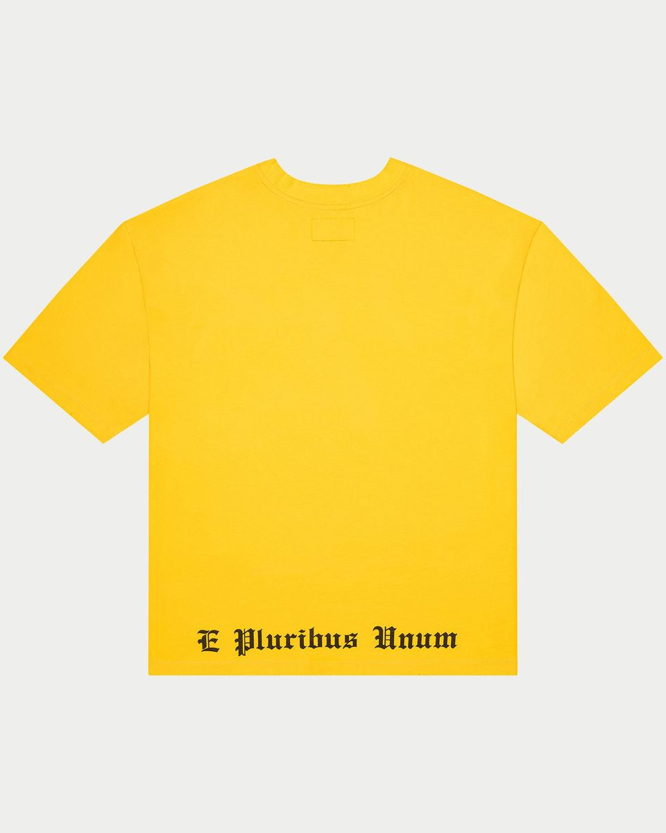 Yellow t-shirt with 'E Pluribus Unum' text on a light gray background