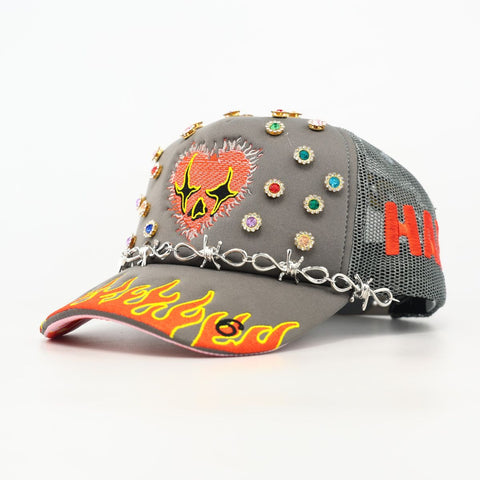 Gray cap with colorful embellishments and text on a white background