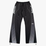 Black athletic pants with gray side panels, white drawstrings, and white 'EPITOME' branding printed vertically on the outer thighs, shown against a light gray background.