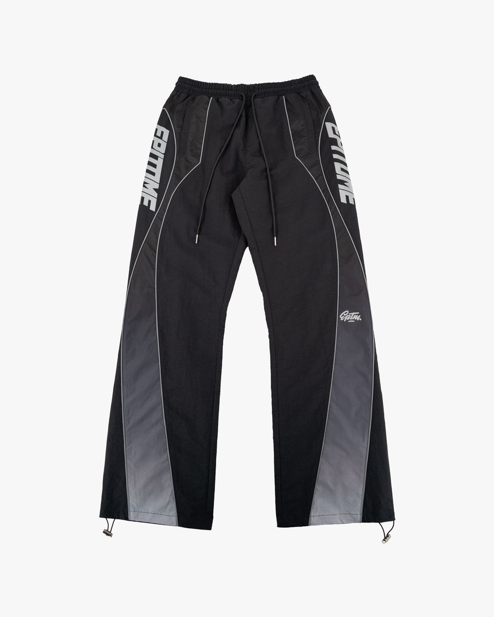 Black athletic pants with gray side panels, white drawstrings, and white 'EPITOME' branding printed vertically on the outer thighs, shown against a light gray background.