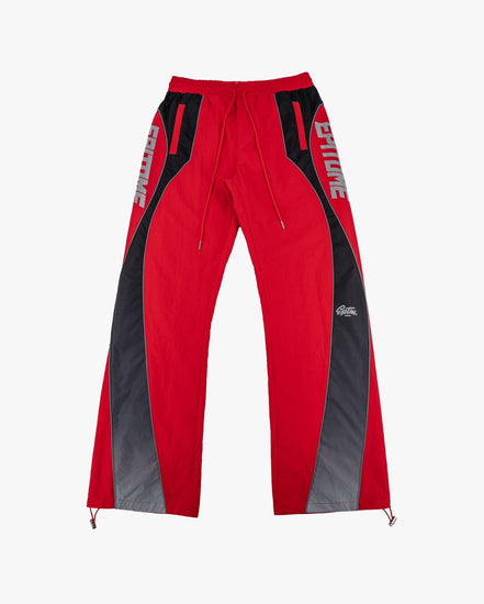 Red and black athletic pants with white 'EPITOME' text on the sides and a small white logo near the lower right leg, shown flat against a light gray background.