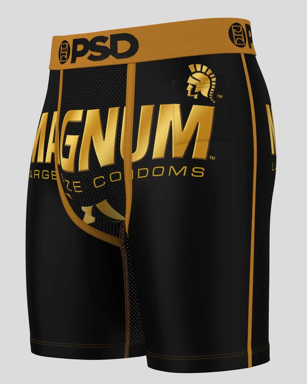 Black and gold shorts with 'Magnum' branding on a gray background
