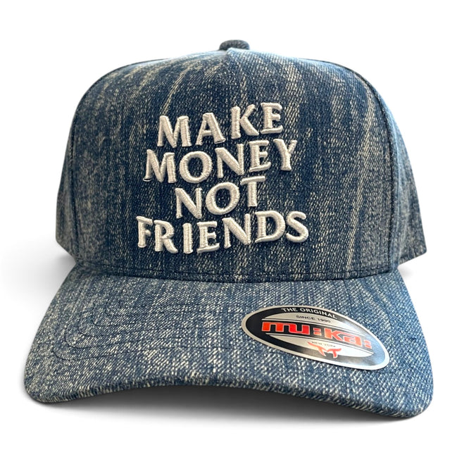 A blue denim-style baseball cap with the phrase 'MAKE MONEY NOT FRIENDS' embroidered in white on the front. A visible sticker on the brim reads 'Tulip'.