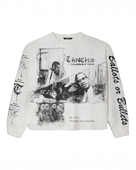 An off-white long-sleeve crewneck sweatshirt featuring a black graphic print of Malcolm X and the text 'TRNCHS MALCOLM X TOUR' on the front, with additional black text down both sleeves, displayed flat against a white background.