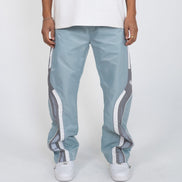 Light blue pants with white stripes worn by a person on a white background
