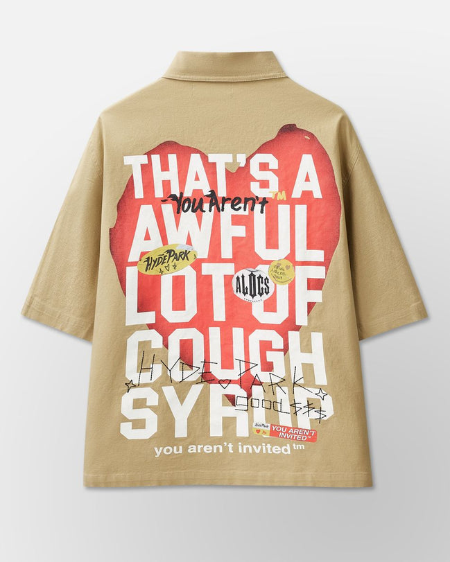 Beige shirt with graphic design and text on a light gray background