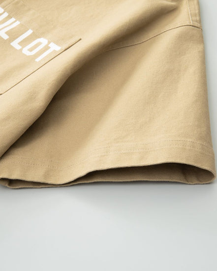 Beige shirt with text and graphics on a light gray background