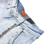 Light blue denim shorts with chain detail on a white background