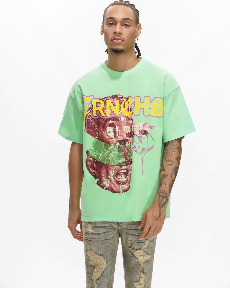 Person wearing a light green t-shirt with graphic design and text on a white background