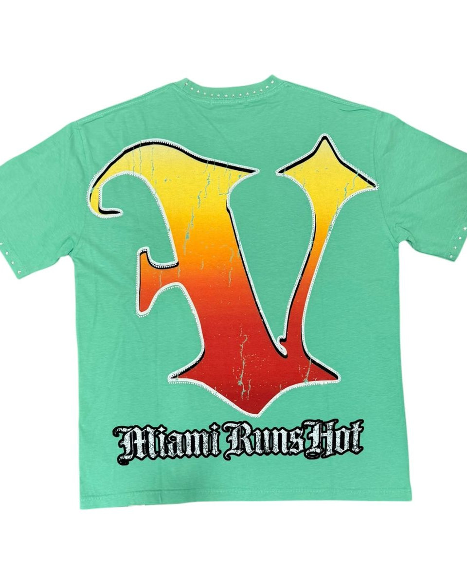 Green t-shirt with a colorful 'V' design and 'Miami Runs Hot' text on a white background