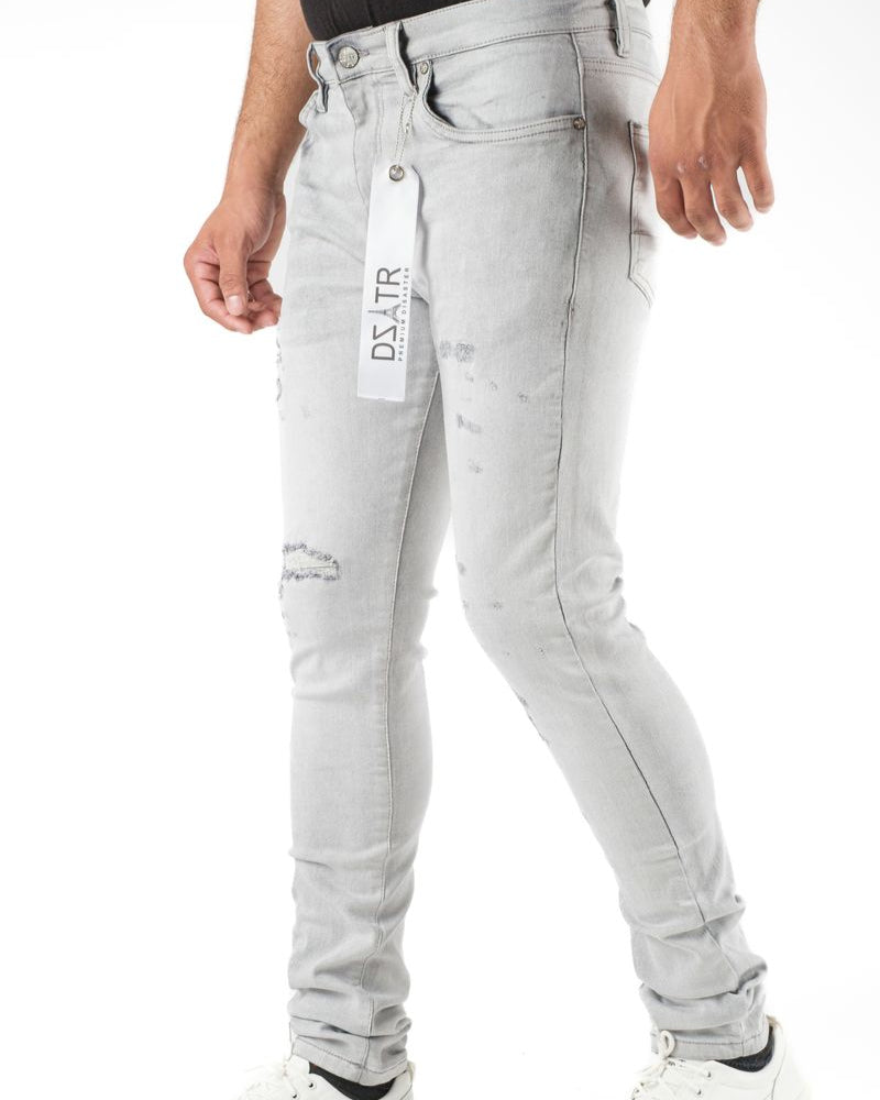 Light gray jeans with a brand label on a white background
