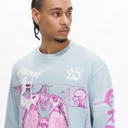 Man wearing a light blue sweatshirt with pink and white graphics on a white background