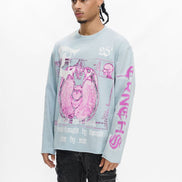 Person wearing a light blue long-sleeve shirt with pink graphic design on a white background